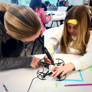 Students working on a drone