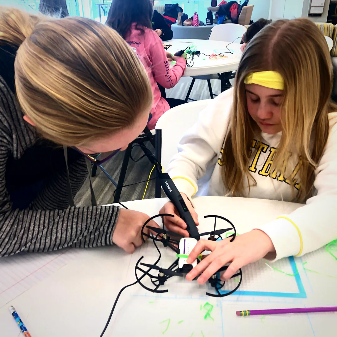 Students working on a drone